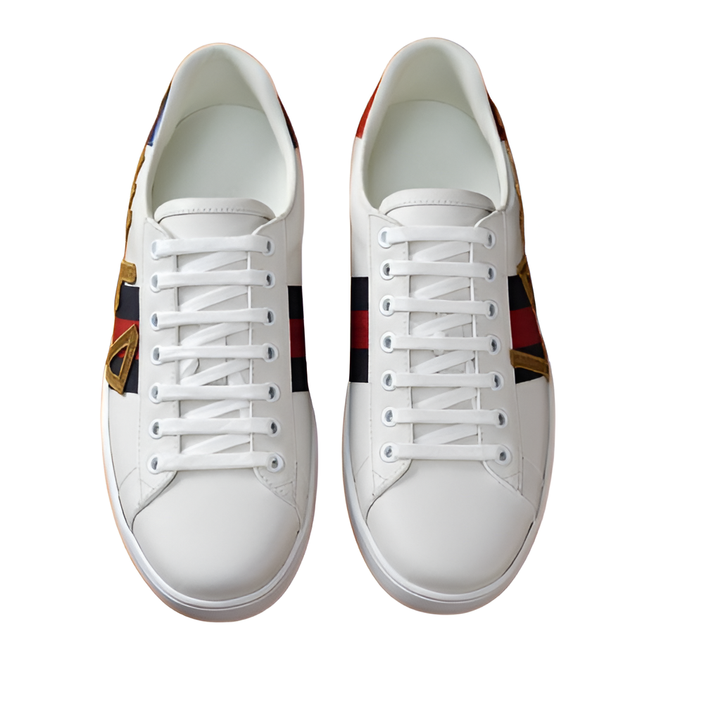 GUCCI Men's White Leather Sneakers with Gold Detail and Web Stripe