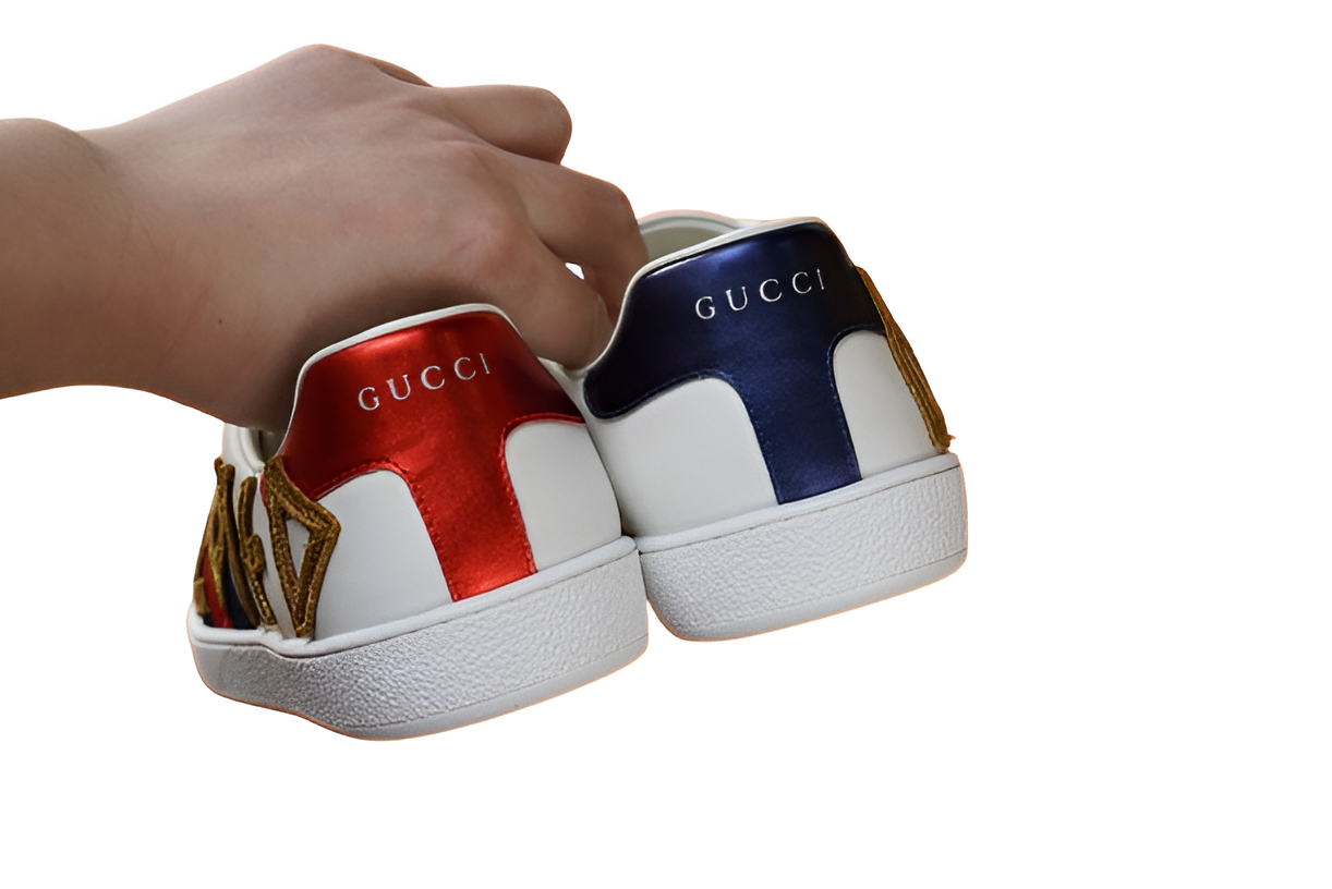 GUCCI Men's White Leather Sneakers with Gold Detail and Web Stripe