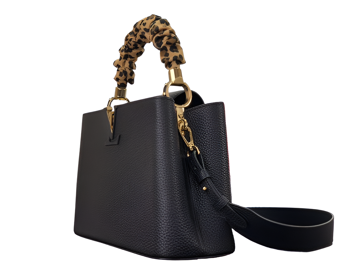 Louis Vuitton black handbag with a stylish leopard print handle