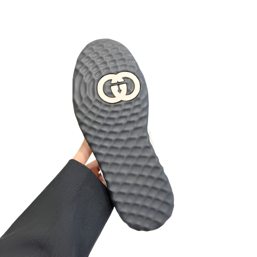 GUCCI Women's Black and White Sneakers with Embossed Logo