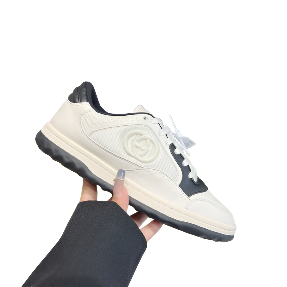 GUCCI Women's Black and White Sneakers with Embossed Logo